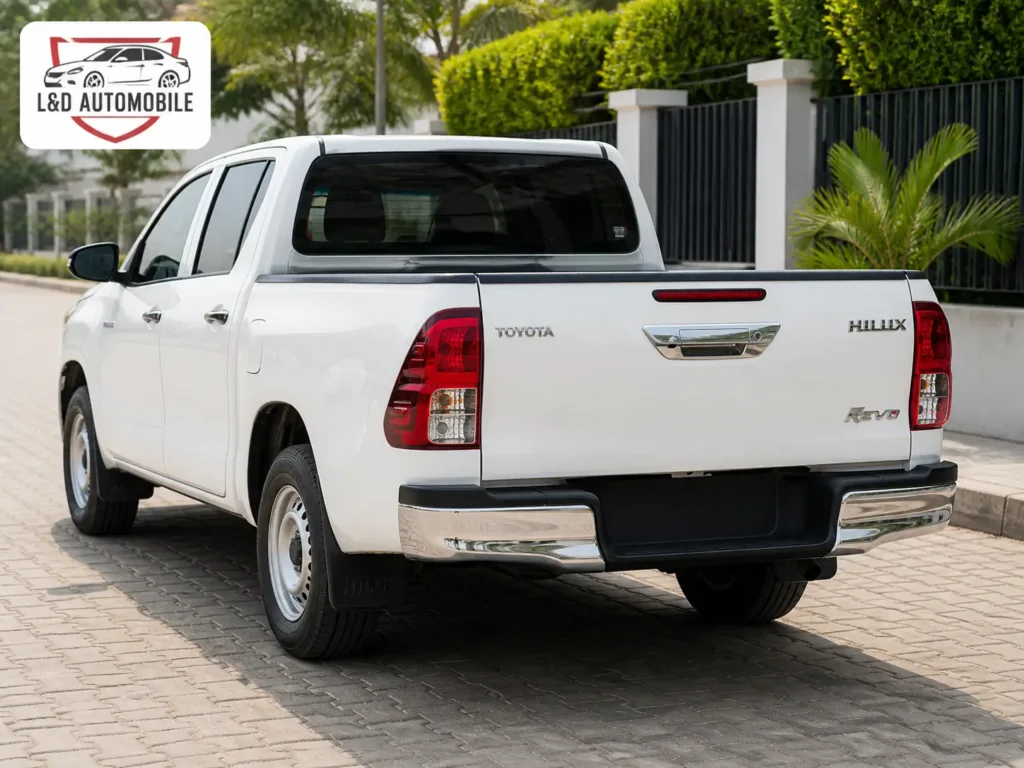 Toyota Hilux Revo white side profile - 4x4 hire Yaoundé Cameroon Toyota Hilux Revo white side profile - 4x4 hire Yaoundé Cameroon